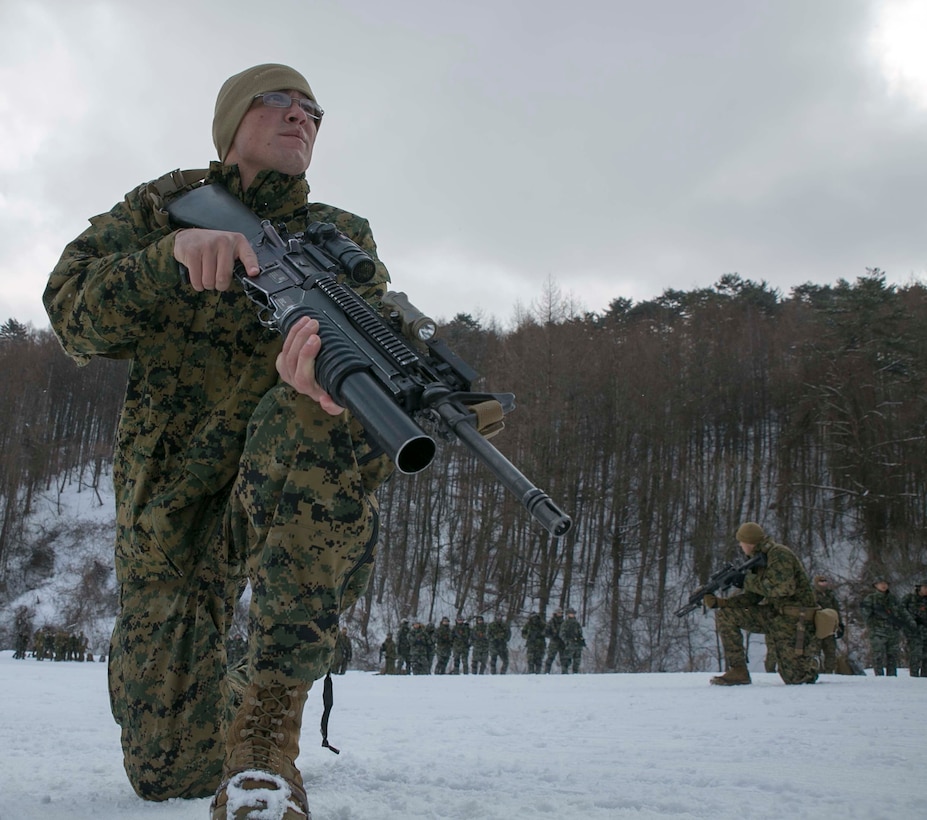 U.S. Marine Lance Cpl. Elias F. Taylor, from Ventura, California, demonstrates combat techniques for Republic of Korea Marines during Korean Marine Exchange Program 15-4 Feb. 5 at the Pyeongchang Winter Training Facility, Pyeongchang, Republic of Korea. Cohesiveness, interoperability and comprehension all play a vital role should the ROK and U.S. Marines need to work together during any future operation, according to U.S. Marine Staff Sgt. Donald J. Leek, platoon sergeant with Company L, 3rd Battalion, 3rd Marine Regiment, currently assigned to 4th Marine Regiment, 3rd Marine Division, III Marine Expeditionary Force under the unit deployment program. The overarching goal of KMEP is to enhance and improve the interoperability of ROK and U.S. Marine Corps forces. Taylor is a rifleman with Company L, 3rd Bn., 3rd Marines, currently assigned to 4th Marines, 3rd Marine Division, III MEF under the unit deployment program. The ROK Marines are with 1st Reconnaissance Battalion, 1st ROK Marine Division. 