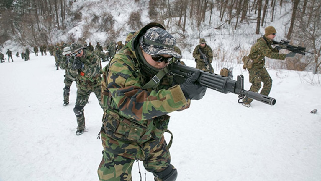Republic of Korea and U.S. Marines perform pivot drills during Korean Marine Exchange Program 15-4 Feb. 5 at the Pyeongchang Winter Training Facility, Pyeongchang, Republic of Korea. This training ensured that the ROK and U.S. Marines’ understanding of each other’s combat tactics is at the highest level possible. The overarching goal of the KMEP is to enhance and improve the interoperability of ROK and U.S. Marine Corps forces. The ROK Marines are with 1st Reconnaissance Battalion, 1st ROK Marine Division. The U.S. Marines are with Company L, 3rd Battalion, 3rd Marine Regiment, currently assigned to 4th Marine Regiment, 3rd Marine Division, III Marine Expeditionary Force under the unit deployment program. (U.S. Marine Corps photo by Pfc. Cedric R. Haller II/Released)