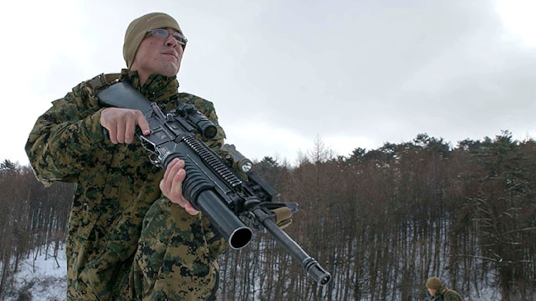 U.S. Marine Lance Cpl. Elias F. Taylor, from Ventura, California, demonstrates combat techniques for Republic of Korea Marines during Korean Marine Exchange Program 15-4 Feb. 5 at the Pyeongchang Winter Training Facility, Pyeongchang, Republic of Korea. Cohesiveness, interoperability and comprehension all play a vital role should the ROK and U.S. Marines need to work together during any future operation, according to U.S. Marine Staff Sgt. Donald J. Leek, platoon sergeant with Company L, 3rd Battalion, 3rd Marine Regiment, currently assigned to 4th Marine Regiment, 3rd Marine Division, III Marine Expeditionary Force under the unit deployment program. The overarching goal of KMEP is to enhance and improve the interoperability of ROK and U.S. Marine Corps forces. Taylor is a rifleman with Company L, 3rd Bn., 3rd Marines, currently assigned to 4th Marines, 3rd Marine Division, III MEF under the unit deployment program. The ROK Marines are with 1st Reconnaissance Battalion, 1st ROK Marine Division. (U.S. Marine Corps photo by Pfc. Cedric R. Haller II/Released)