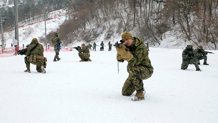 Republic of Korea and U.S. Marines train for tactical patrols during Korean Marine Exchange Program 15-4 Feb. 5 at the Pyeongchang Winter Training Facility, Pyeongchang, Republic of Korea. Cohesiveness, interoperability and comprehension all play a vital role should the ROK and U.S. Marines need to work together during any future operation, according to U.S. Marine Staff Sgt. Donald J. Leek, platoon sergeant with Company L, 3rd Battalion, 3rd Marine Regiment, currently assigned to 4th Marine Regiment, 3rd Marine Division, III Marine Expeditionary Force under the unit deployment program. KMEP is a regularly scheduled, bilateral, small-unit training exercise, which enhances the combat readiness and interoperability of ROK and U.S. Marine Corps’ forces. The ROK Marines are with 1st Reconnaissance Battalion, 1st ROK Marine Division. The U.S. Marines are with Company L, 3rd Bn., 3rd Marines, currently assigned to 4th Marines, 3rd Marine Division, III MEF under the unit deployment program. (U.S. Marine Corps photo by Pfc. Cedric R. Haller II/Released)