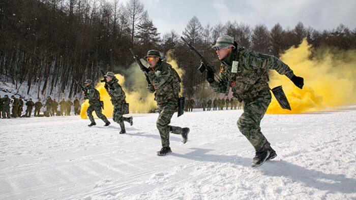 Republic of Korea Marines demonstrate their combat tactics for U.S. Marines during Korean Marine Exchange Program 15-4 Feb. 4 at the Pyeongchang Winter Training Facility, Pyeongchang, Republic of Korea. Sharing cultures is a significant factor in gaining a better understanding of the combat tactics of the two forces despite the language barrier, according to ROK Marine Capt. Moon Jung Hwan. KMEP is a regularly scheduled, bilateral, small-unit training exercise, which enhances the combat readiness and interoperability of ROK and U.S. Marine Corps’ forces. The ROK Marines are with 1st Reconnaissance Battalion, 1st ROK Marine Division. The U.S. Marines are with Company L, 3rd Battalion, 3rd Marine Regiment, currently assigned to 4th Marine Regiment, 3rd Marine Division, III Marine Expeditionary Force under the unit deployment program. (U.S. Marine Corps photo by Pfc. Cedric R. Haller II/Released)