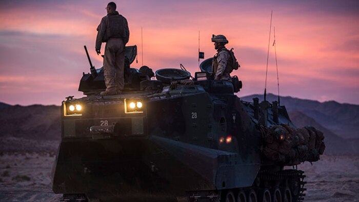 Assault amphibious vehicles are used to mobilize infantry units during the Integrated Training Exercise 2-15 Tank Mechanized Assault Course Feb. 2 at Marine Air Ground Combat Center Twentynine Palms. AAVs are used to get infantry in the fight fast. The AAVs that were used during the TMAC are with Company D, 3rd Assault Amphibian Battalion, 1st Marine Division, I Marine Expeditionary Force. (U.S. Marine Corps photo by Lance Cpl. William Hester/Released)