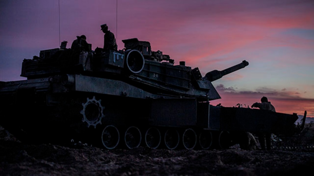 Marines perform maintenance on their M1A1 Abrams Main Battle Tank Feb. 1 at Marine Air Ground Combat Center Twentynine Palms before the Tank Mechanized Assault Course. The TMAC allows Marines to train with different elements within the Marine Air-Ground Task Force and integrate fires for a combined arms assault. The Marines are with Company D, 1st Tank Battalion, 1st Marine Division, I Marine Expeditionary Force. (U.S. Marine Corps photo by Lance Cpl. William Hester)