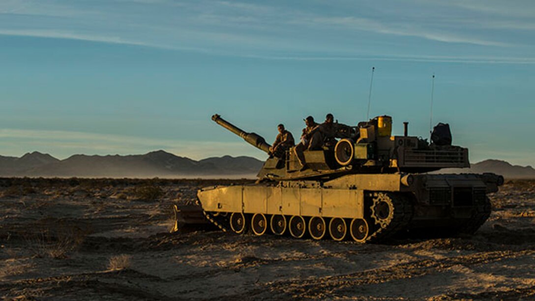 Marines complete maintanence and operations checks on an M1A1 Abrams Main Battle Tank Jan. 1 at Marine Air Ground Combat Center Twentynine Palms as part of Integrated Training Exercise 2-15. The TMAC involves air and ground capabilities in one event to demonstrate different capabilities of a Marine Air-Ground Task Force. The Marines are with Company D, 1st Tank Battalion, 1st Marine Division, I Marine Expeditionary Force. (U.S. Marine Corps photo by Lance Cpl. William Hester)