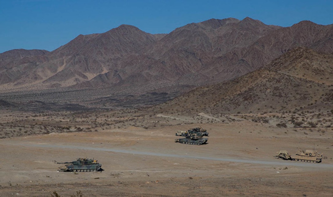 M1A1 Abrams Main Battle Tanks move through the “Delta Prospect” training area Jan. 2 at Marine Air Ground Combat Center Twentynine Palms during the Integrated Training Exercise 2-15 Tank Mechanized Assault Course . The TMAC allows ground and air elements of the Marine Air-Ground Task Force to train together. The Marines are with Company D, 1st Tank Battalion, 1st Marine Division, I Marine Expeditionary Force. (U.S. Marine Corps photo by Lance Cpl. William Hester)