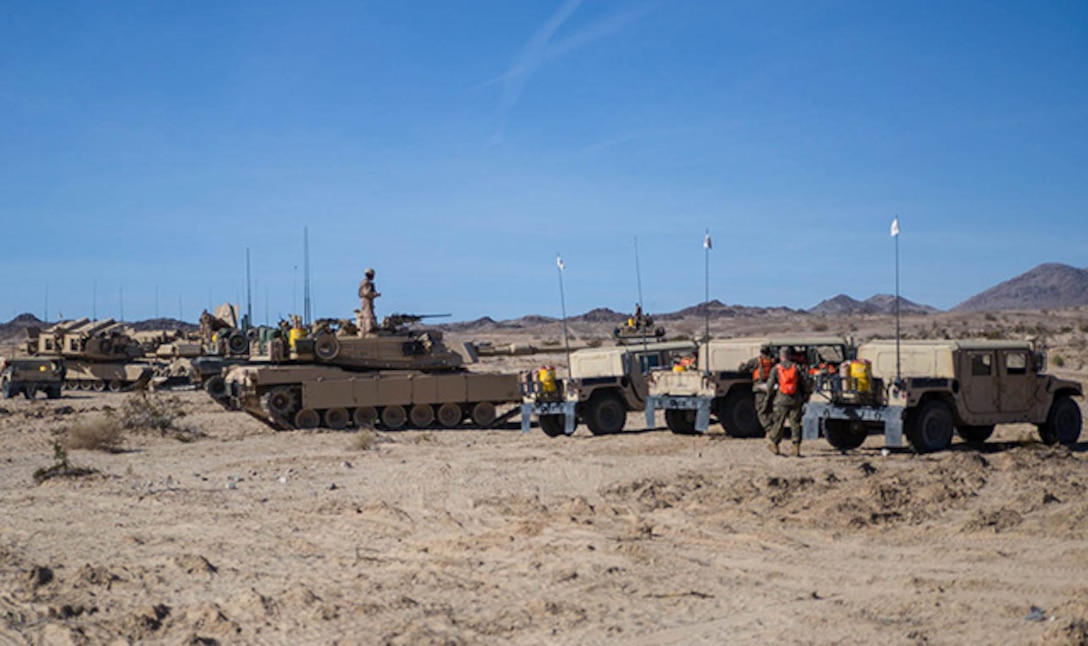 Company D brings  vehicles into formation Jan. 2 before the Tank Mechanized Assault Course at Marine Air Ground Combat Center Twentynine Palms during Integrated Training Exercise 2-15. The TMAC is an assault on multiple objectives using different elements of the Marine Air-Ground Task Force. ITX 2-15 incorporates different scenarios to allow all of the elements of a MAGTF to work together. The Marines are with Company D, 1st Tank Battalion, 1st Marine Division, I Marine Expeditionary Force. (U.S. Marine Corps photo by Lance Cpl. William Hester)
