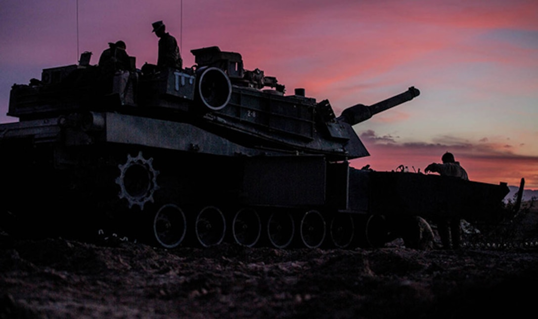 Marines perform maintenance on their M1A1 Abrams Main Battle Tank Feb. 1 at Marine Air Ground Combat Center Twentynine Palms before the Tank Mechanized Assault Course. The TMAC allows Marines to train with different elements within the Marine Air-Ground Task Force and integrate fires for a combined arms assault. The Marines are with Company D, 1st Tank Battalion, 1st Marine Division, I Marine Expeditionary Force. (U.S. Marine Corps photo by Lance Cpl. William Hester)