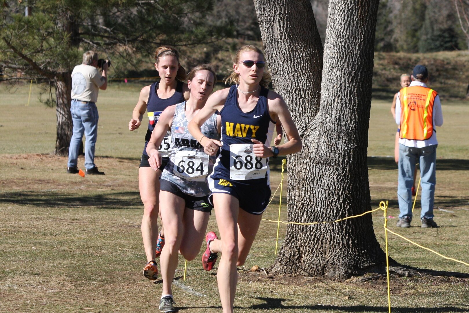 Navy Lt. Amanda Rice, ATSUGI Japan (#688), second place Armed Forces finisher (35th overall) after passing Army runner 1st Lt. Chelsea Prahl (#684, 5th in Armed Forces). The 2015 Armed Forces Cross Country was conducted in conjunction with the USA Track and Field Cross Country National Championship in Boulder, Colo. on Feb. 7.