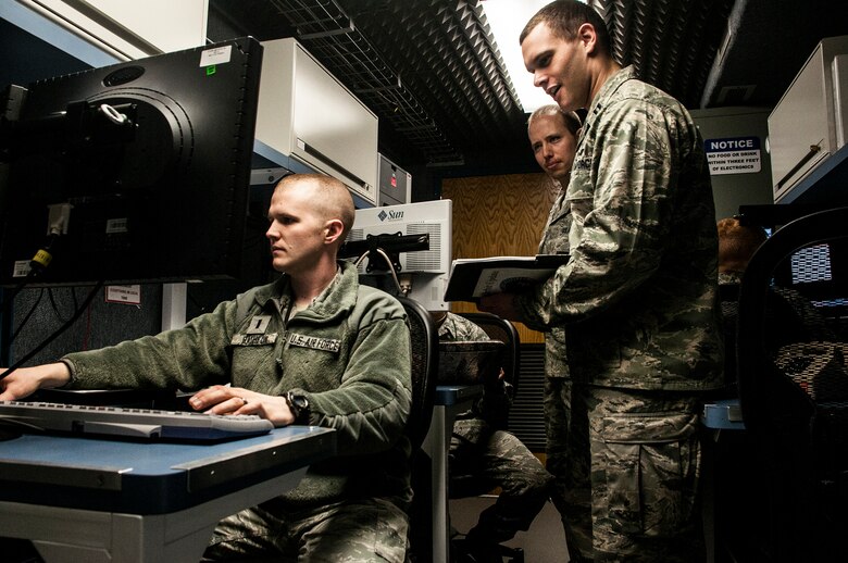 Airmen resolve satellite anomalies from their advanced ground mobile units Jan. 13, 2015, at Schriever Air Force Base, Colo. The squadron is responsible for command and control of the Milstar/Advanced Extremely High Frequency satellite constellation. The Air Force concluded a six-month rigorous and complex multiservice operational test and evaluation of its AEHF system in January. The Airmen are assigned to the 4th Space Operations Squadron. (U.S. Air Force photo/Staff Sgt. Julius Delos Reyes)