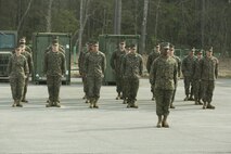 Marines with Marine Air Ground Task Force Materiel Distribution Company stand in formation during the company’s activation ceremony, Feb. 9, 2015, aboard Camp Lejeune, North Carolina. The company has been created within 2nd Supply Battalion, Combat Logistics Regiment 25, 2nd Marine Logistics Group, to establish a proof of principle on the reorganization of intermediate supply and distribution capabilities in order to provide tailored capabilities to units deploying in support of II Marine Expeditionary Force. This new company will be comprised of some preexisting platoons from Supply Company, as well as a motor transportation capability from the Headquarters and Support Company and an additional 30 Marines to form Distribution Liaison Cells. (U.S. Marine Corps photo by Cpl. Elizabeth A. Case/Released)
