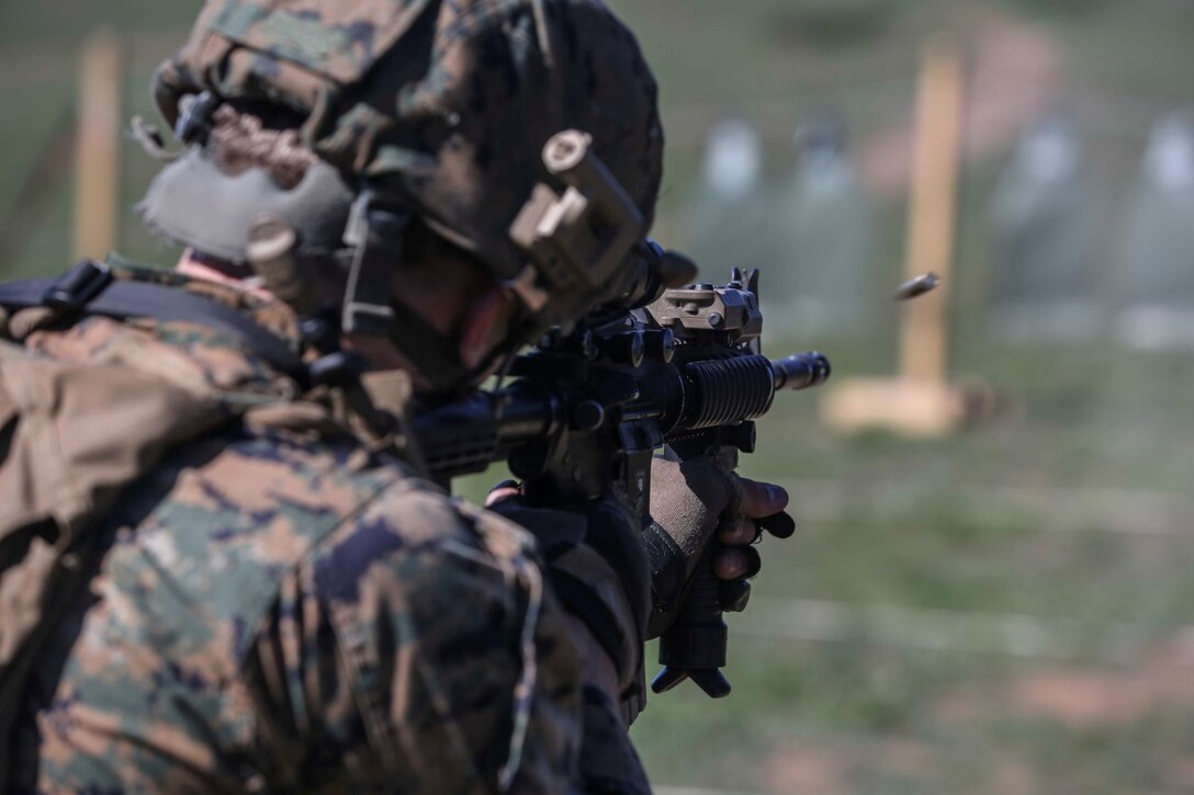A U.S. Marine with Combat Logistics Battalion 15, 15th Marine Expeditionary Unit, engages his target during combat marksmanship training aboard Camp Pendleton, Calif., Feb. 9, 2015. The Marine Corps Combat Marksmanship Program is designed to keep Marines in a combat mindset. As the logistics combat element for the 15th MEU, CLB-15 is training to ensure readiness for any situation they may encounter during their upcoming deployment this spring. (U.S. Marine Corps photo by Cpl. Anna Albrecht/Released)