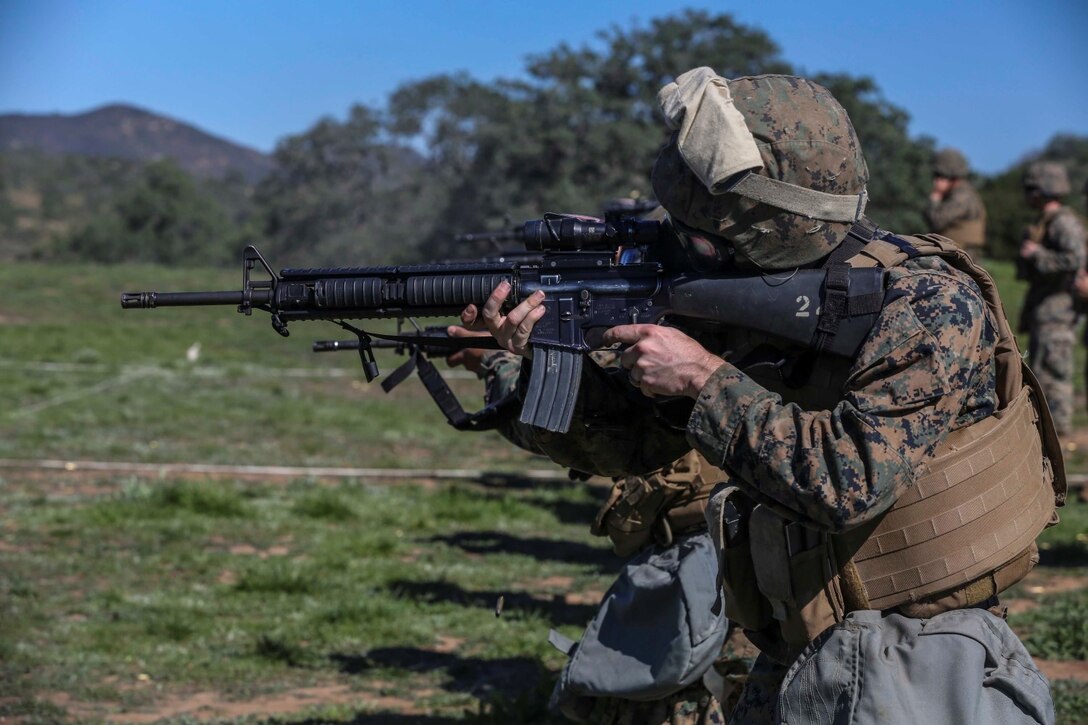 U.S. Marines with Combat Logistics Battalion 15, 15th Marine Expeditionary Unit, engage their targets during combat marksmanship training aboard Camp Pendleton, Calif., Feb. 9, 2015. The Marine Corps Combat Marksmanship Program is designed to keep Marines in a combat mindset.  As the logistics combat element for the15th MEU, CLB-15 is training to ensure readiness for any situation they may encounter during their upcoming deployment this spring. (U.S. Marine Corps photo by Cpl. Anna Albrecht/Released)