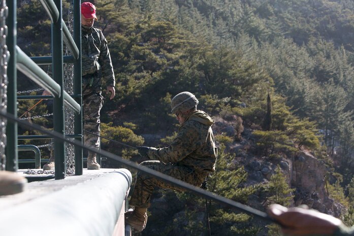 POHANG, South Korea (Feb. 8, 2015) - U.S. Marine Lance Cpl. Matthew T. Joeckel, a Houston, Texas, native, prepares to rappel down the tower during Korean Marine Exchange Program (KMEP) 15-17 at the Minam-ri Mountain Warfare Training Facility, Pohang.  Training alongside the Republic of Korea (ROK) Marines gave the U.S. Marines the unique opportunity to revisit a familiar skill with a foreign force. The overarching goal of KMEP is to enhance and improve the interoperability of ROK and U.S. Marine Corps forces. Joeckel is a rifleman with Company K, 3rd Battalion, 3rd Marine Regiment, currently assigned to 4th Marine Regiment, 3rd Marine Division, III Marine Expeditionary Force under the unit deployment program. 