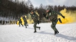PYEONGCHANG, Republic of Korea (Feb. 4, 2015) - Republic of Korea (ROK) Marines demonstrate their combat tactics for U.S. Marines during Korean Marine Exchange Program 15-4 at the Pyeongchang Winter Training Facility.  Sharing cultures is a significant factor in gaining a better understanding of the combat tactics of the two forces despite the language barrier, according to ROK Marine Capt. Moon Jung Hwan. KMEP is a regularly scheduled, bilateral, small-unit training exercise, which enhances the combat readiness and interoperability of ROK and U.S. Marine Corps’ forces. The ROK Marines are with 1st Reconnaissance Battalion, 1st ROK Marine Division. The U.S. Marines are with Company L, 3rd Battalion, 3rd Marine Regiment, currently assigned to 4th Marine Regiment, 3rd Marine Division, III Marine Expeditionary Force under the unit deployment program. 