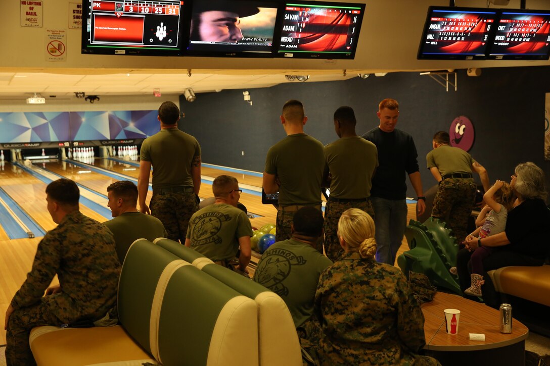Marines gather at the Sandy Hills Bowling Center for the Grand Re-Opening and 35th Anniversary Celebration at the Sandy Hills Bowling Center, Jan. 29, 2015. Later on in the day, there was a pizza eating contest and the 1st, 2nd and 3rd place winners were awarded prizes. (Official Marine Corps Photo by Lance Cpl. Olivia Day/Released)