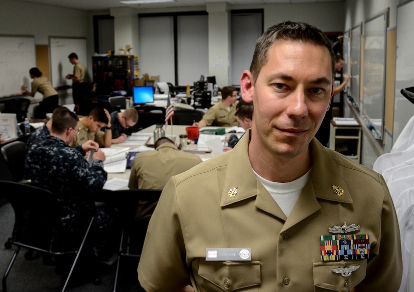 Senior Chief Bartholomew Levin, Naval Nuclear Power Training Command instructor, is one of many faculty members who stay after hours to help students understand their challenging curriculum Feb. 9, 2015, at Joint Base Charleston – Weapons Station. The school trains Sailors to operate, maintain and supervise naval nuclear propulsion plants. (U.S. Air Force photo/ Senior Airman Dennis Sloan)