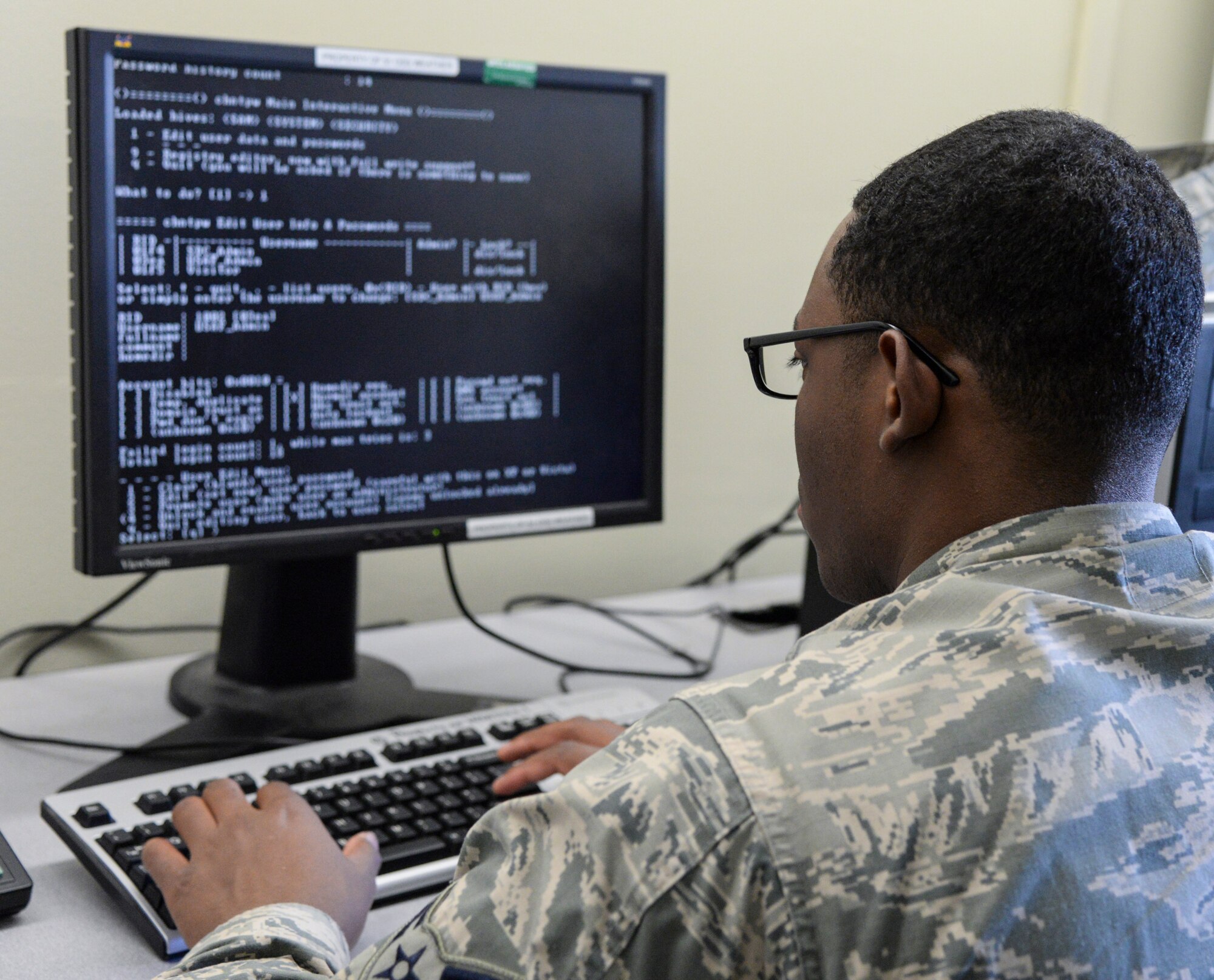 Airman 1st Class Michael Merritt, a 51st Communications Squadron client systems technician, reconnects a computer to the non-secure internet protocol Feb. 6, 2015, at Osan Air Base, Republic of Korea. Depending on the type of trouble ticket they receive their task can take from an hour to a whole day. (U.S. Air Force photo by Senior Airman Matthew Lancaster)