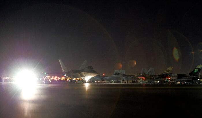 An F-22 Raptor assigned to the 94th Fighter Squadron, Joint Base Langley-Eustis, Va., taxis toward the runway at Nellis Air Force Base, Nev., Feb. 4, 2015. Red Flag provides realistic combat training in a contested, degraded and operationally-limited environment. These stressors provide aircrews with real-time war scenarios and helps ground crews test and improve their operational readiness. (U.S. Air Force photo by Airman 1st Class Mikaley Towle)