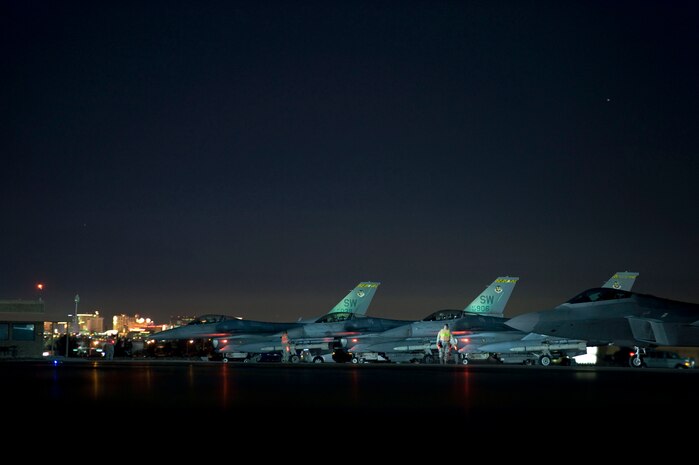 Three F-16 Fighting Falcons assigned to the 20th Fighter Wing, Shaw Air Force Base, S.C., wait at the end-of-runway before a Red Flag 15-1 training mission at Nellis Air Force Base, Nev., Feb. 4, 2015. Red Flag missions are conducted on the 2.9 million acre Nevada Test and Training Range with 1,900 possible targets, realistic threat systems and simulated opposing enemy forces. (U.S. Air Force photo by Airman 1st Class Mikaley Towle)