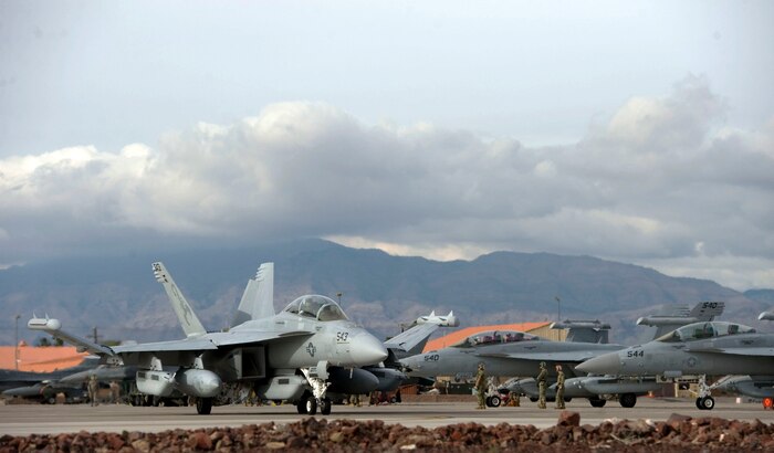 An EA-18G Growler assigned to the Tactical Electronic Warfare Squadron 132, Naval Air Station Whidbey Island, Wash., taxis toward the runway prior to flying a Red Flag 15-1 training mission at Nellis Air Force Base, Nev., Jan. 28, 2015. Red Flag is one of a series of advanced training programs administered by the U.S. Air Force Warfare Center. (U.S. Air Force photo by Airman 1st Class Mikaley Towle)