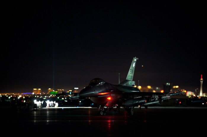 An F-16 Fighting Falcon assigned to the 79th Fighter Squadron, Shaw Air Force Base, S.C., taxis during Red Flag 15-1 at Nellis Air Force Base, Nev., Feb. 4, 2015. Red Flag exercises provide a series of intense scenarios for aircrew and ground personnel to increase their combat readiness and effectiveness for future real-world missions. (U.S. Air Force photo by Staff Sgt. Siuta B. Ika)