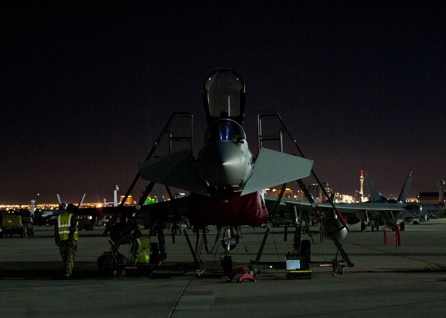 Two Royal Air Force crew chiefs work on a Typhoon FGR4 assigned to 1 (Fighter) Squadron, RAF Lossiemouth, Scotland, during Red Flag 15-1 at Nellis Air Force Base, Nev., Feb. 4, 2015. The Typhoon is a multi-role combat aircraft capable of being deployed in the full spectrum of air operations from air policing to peace support through high-intensity conflict. (U.S. Air Force photo by Staff Sgt. Siuta B. Ika)