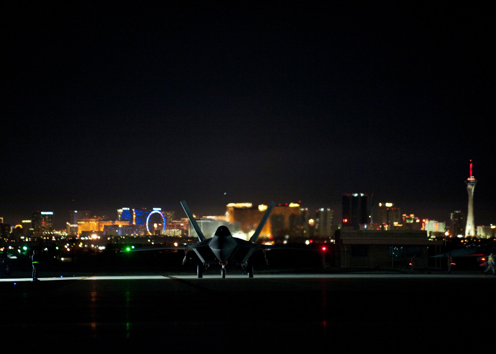 An F-22 Raptor assigned to the 94th Fighter Squadron, Langley Air Force Base, Va., taxis during Red Flag 15-1 at Nellis Air Force Base, Nev., Feb. 4, 2015. Red Flag is a realistic combat exercise involving U.S. and allied air forces conducting training operations on the 15,000 square mile Nevada Test and Training Range during day and night operations. (U.S. Air Force photo by Staff Sgt. Siuta B. Ika)