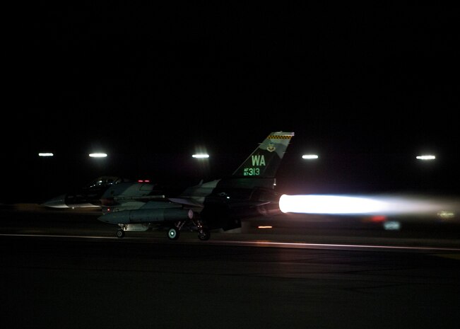 An F-16 Fighting Falcon assigned to the 64th Aggressor Squadron launches during Red Flag 15-1 at Nellis Air Force Base, Nev., Feb. 4, 2015. Aggressors are specially trained to replicate the tactics and techniques used by potential adversaries to better prepares U.S. and allied forces for potential future conflicts. (U.S. Air Force photo by Staff Sgt. Siuta B. Ika)