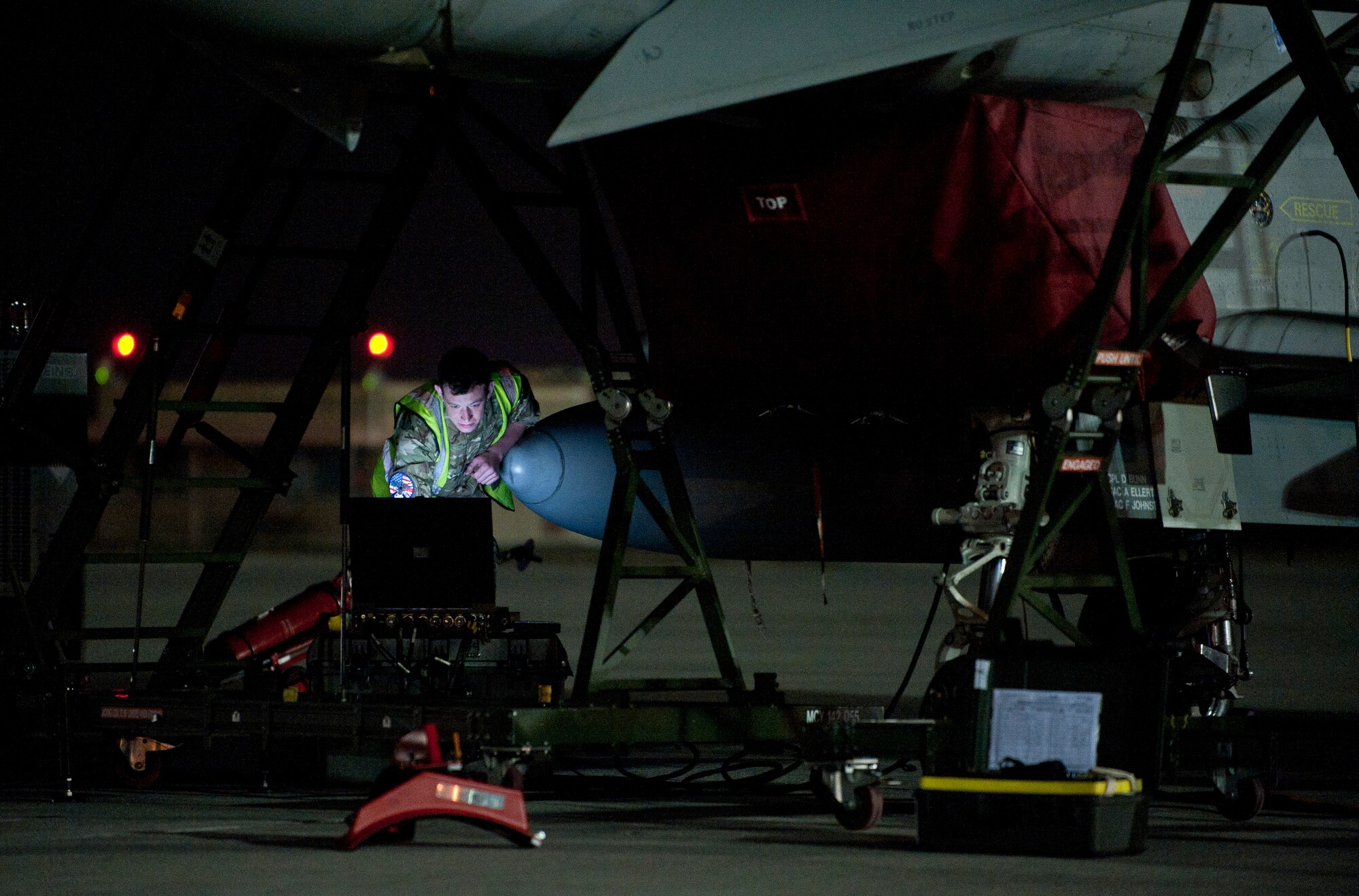 A Royal Air Force maintainer looks at tech data during Red Flag 15-1 at Nellis Air Force Base, Nev., Feb. 4, 2015. Flying units from around the world come to Nellis AFB to participate in Red Flag exercises, which are held three to four times per year. (U.S. Air Force photo by Staff Sgt. Siuta B. Ika)