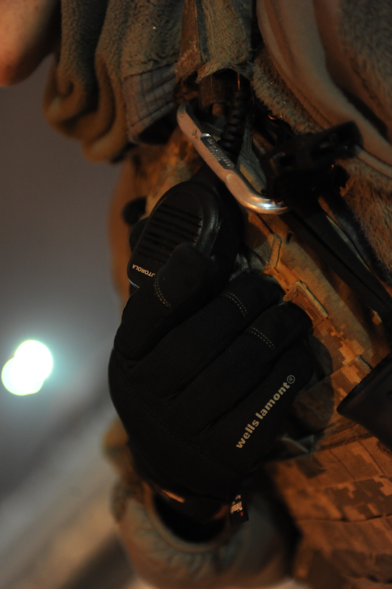 Senior Airman Sergio Romo, 5th Security Forces Squadron law enforcement patrolman, speaks with his leadership via walkie-talkie on Minot Air Force Base, N.D., Jan. 24, 2015. Romo is in constant contact with command and control and responds to any suspicious activity in his area that they relay to him. (U.S. Air Force photo/Senior Airman Stephanie Morris)