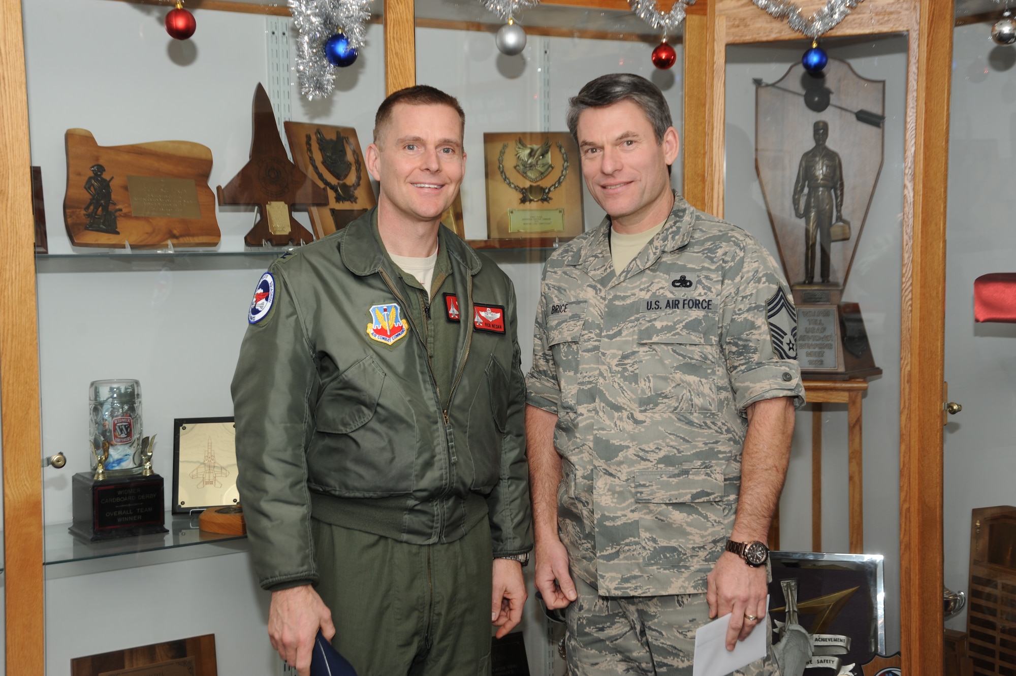 Col. Richard Wedan, 142nd Fighter Wing commander Chief Master Sgt. Donald Brice, assigned to the 142nd Fighter Wing Maintenance Group, pause for a photograph after a meeting at the Portland Air National Guard Base, Portland, Ore., Dec. 12, 2012. (U.S. Air National Guard photo by Tech. Sgt. John Hughel/Released)