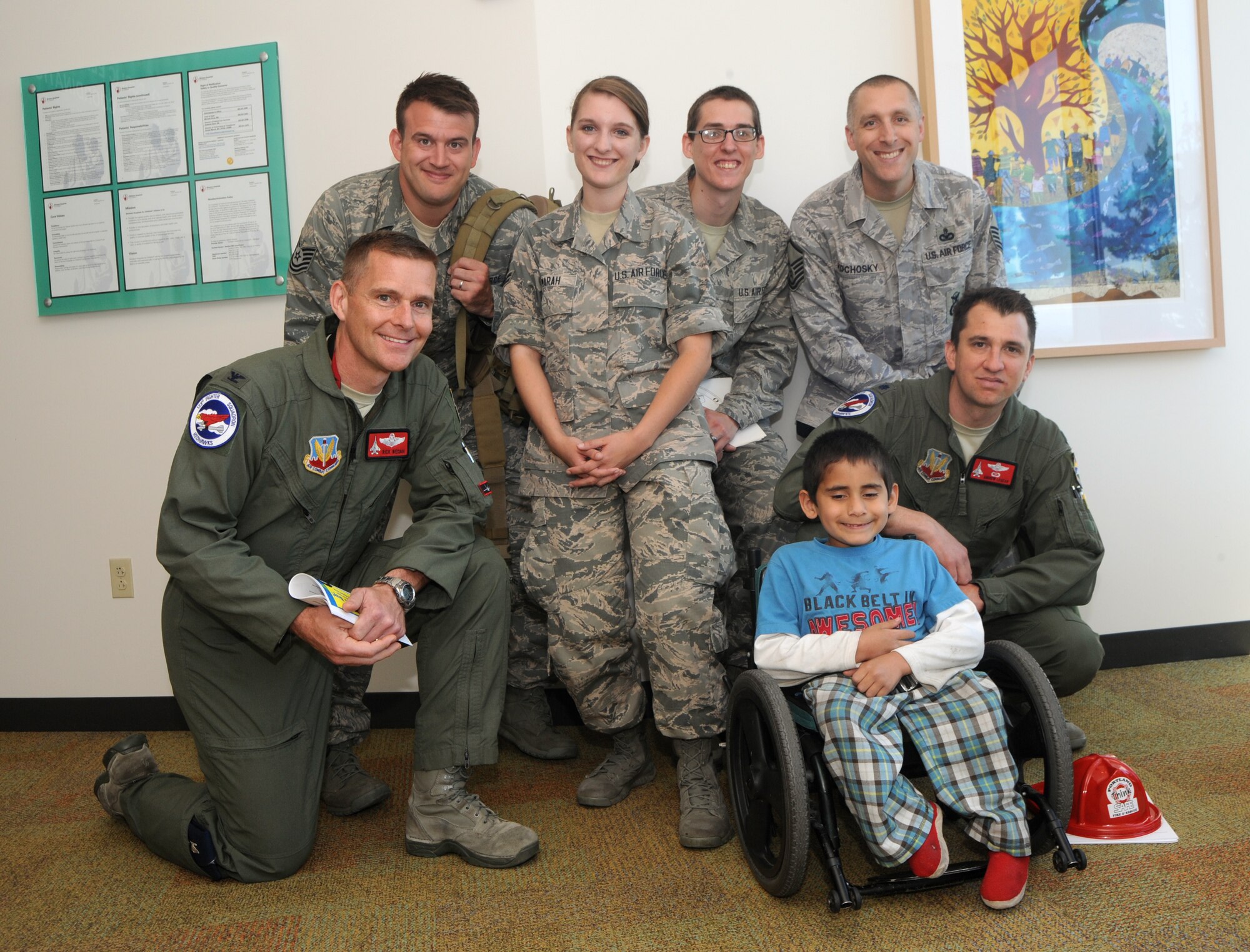 Col. Richard Wedan, 142nd Fighter Wing commander and other members of the 142nd Fighter Wing spend a day at the Shriner's Hospital for Children in Portland, Ore., July 7, 2014. (U.S. Air National Guard photo by Tech. Sgt. John Hughel/Released)
