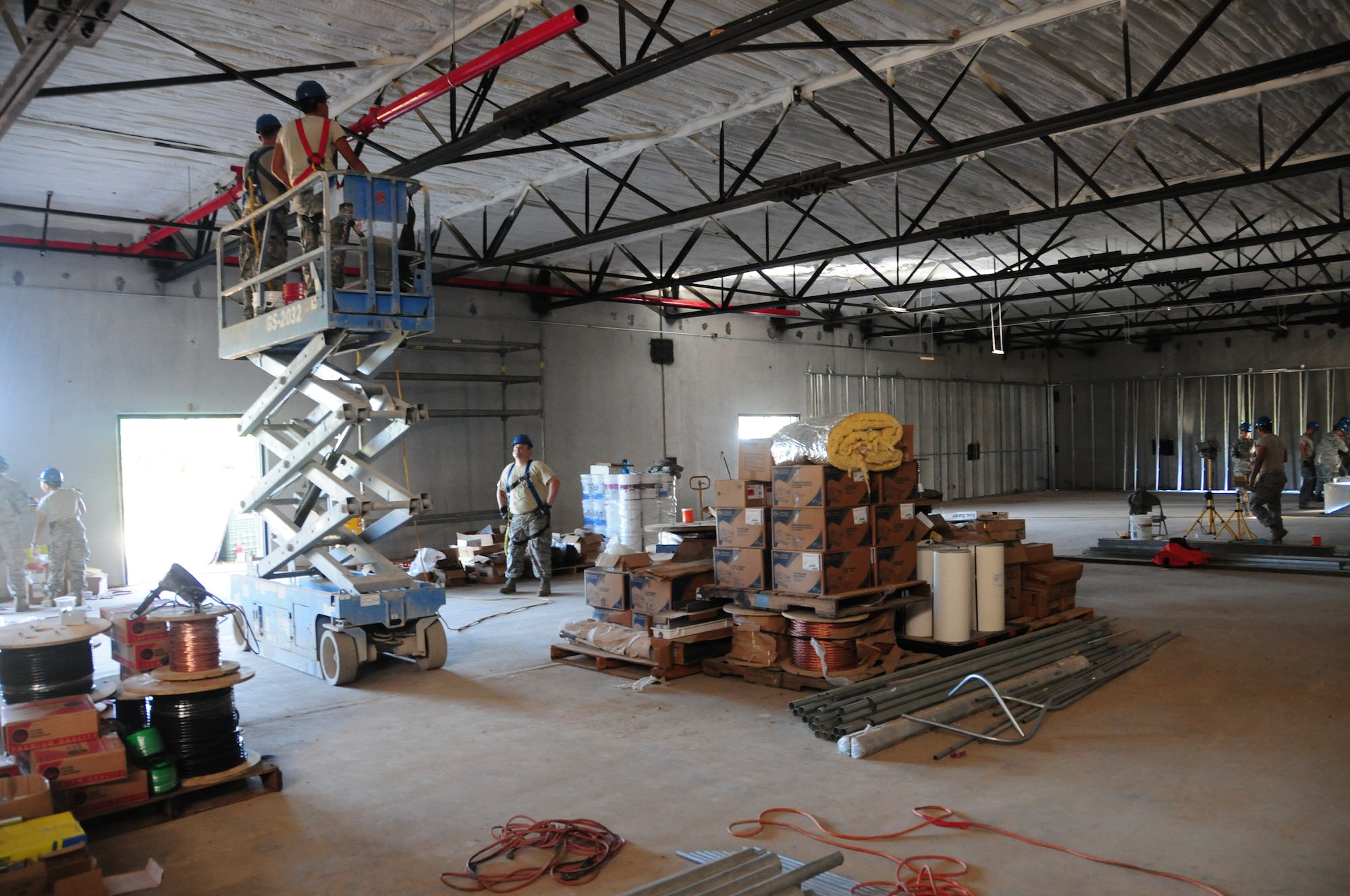 U.S. Air National Guard Airmen from the 146th Airlift Wing Civil Engineering Squadron work at the main building while on TDY in Guam at Andersen AFB on February 5, 2015. (U.S. Air National Guard photo by Airman 1st Class Madeleine Richards/Released) 