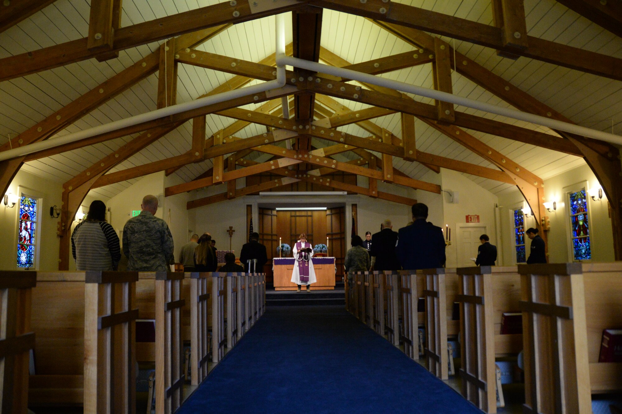 California Air National Guardsmen with the 129th Rescue Wing chaplain's office provide worship services during the grand re-opening of Moffett Chapel at Moffett Federal Airfield, Calif., Dec. 7, 2014.  The Moffett Chapel has been closed for two and a half years.  (U.S. California Air National Guard photo by Tech. Sgt. Ray Aquino/Released)