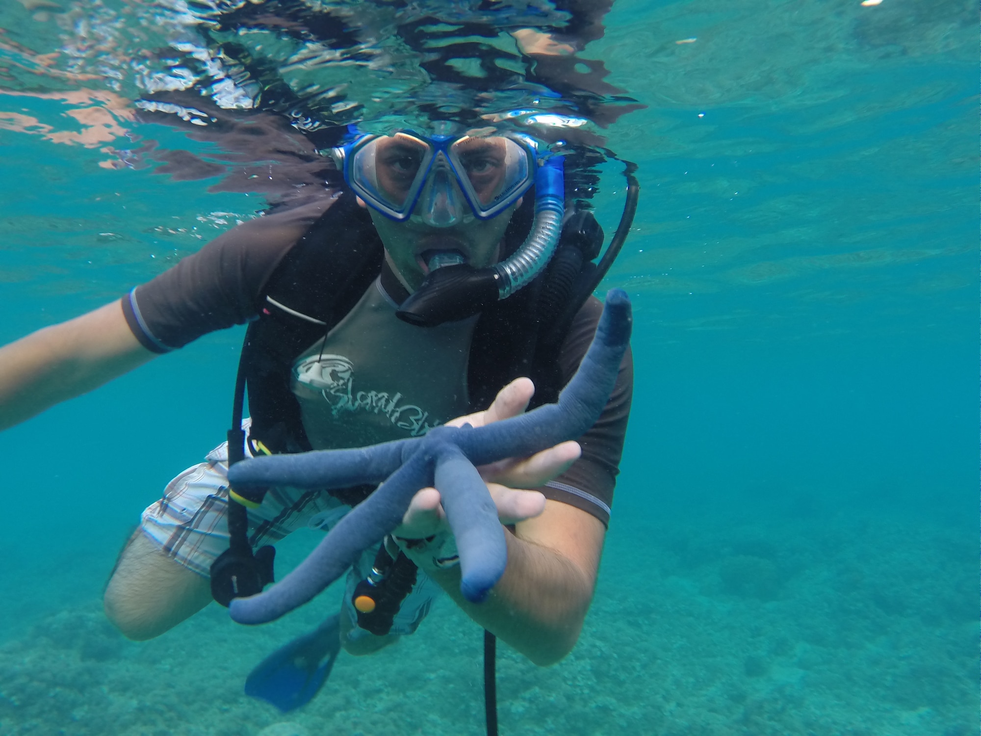 U.S. Air National Guard Staff Sgt. Xavier Martinez-Soto from the 146th Airlift Wing Civil Engineering Squadron snorkels with local underwater sea creatures at Gab Gab Beach in Guam on February 1, 2015. (U.S. Air National Guard photo by Staff Sgt. Sonny DaSilva/Released)