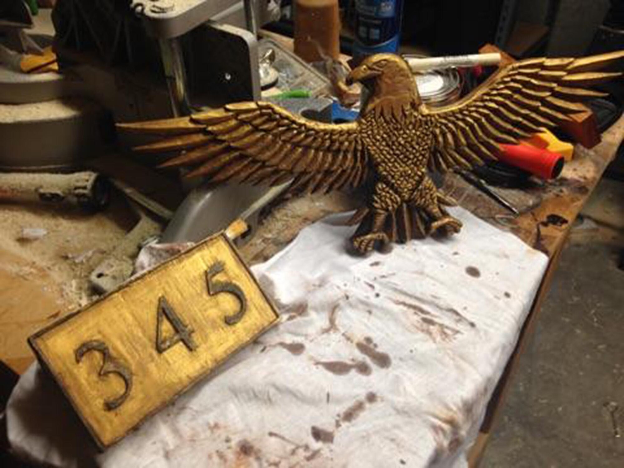 This eagle was handcarved by Master Sgt. Raymond Boyd, 345th Recruiting Squadron A-Flight chief, who unveiled it at a quarterly training meeting in August 2014. He spent more than 40 hours constructing this work of art that will endure as the standard of the 345th RCS Screaming Eagles. (U.S. Air Force photo)
