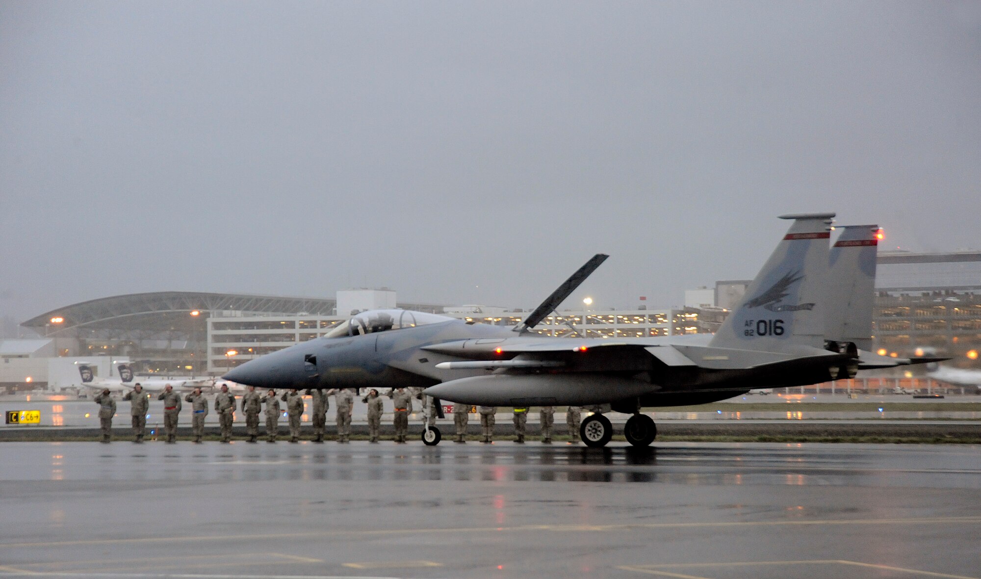 Members of the 142nd Fighter Wing maintenance crews salute their Wing Commander, Col. Richard W. Wedan, as he taxis in preparation for his last flight in an F-15 Eagle and as a member of the Oregon Air National Guard.  Col. Wedan retired during a ceremony held here Feb. 7, 2015, at the Portland Air National Guard Base, Oregon. (U.S. Air National Guard photo by Tech. Sgt. John Hughel, 142nd Fighter Wing Public Affairs/Released)