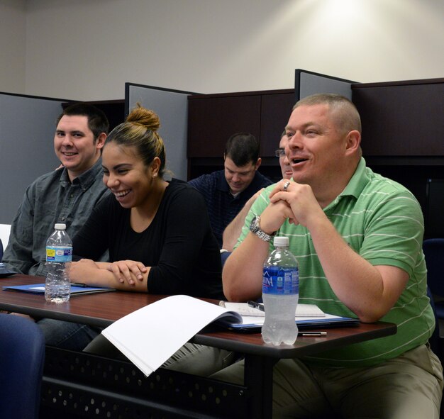 Transition Assistance Program participants share a laugh as they take part in a teambuilding assignment Feb. 9, 2015, at Moody Air Force Base, Ga. During the exercise, attendees expressed that steady income is what they will miss most after separating. (U.S. Air Force photo by Airman Greg Nash/Released)