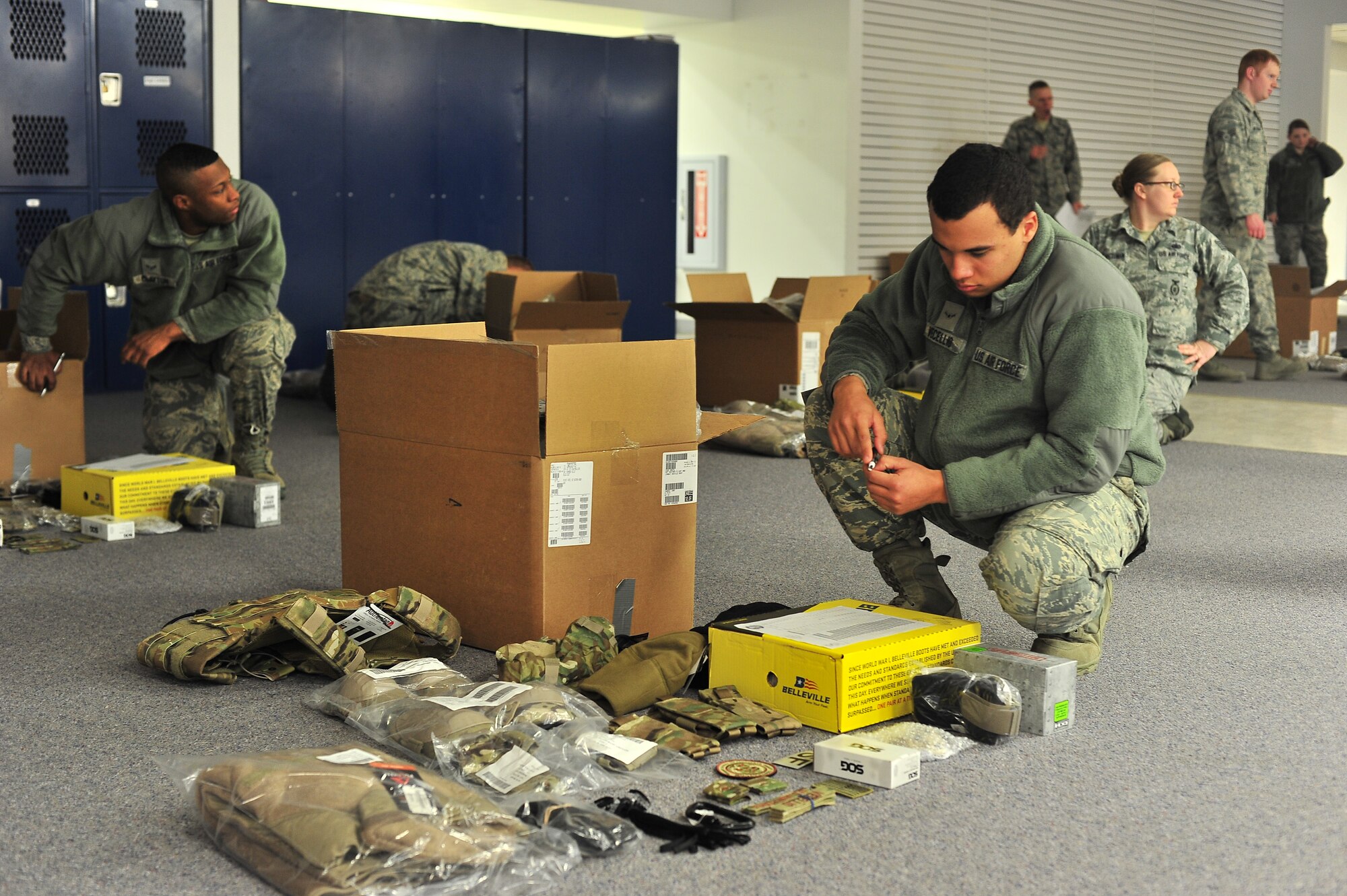 Members of the 91st Security Forces Group and the 5th Security Forces Squadron receive their new Operational Camouflage Pattern uniform on Minot Air Force Base, N.D., Feb. 2, 2014. All Security Forces members in Air Force Global Strike Command will receive the new uniform, with an official wear date of Feb. 9, 2015. (U.S. Air Force photo/Senior Airman Brittany Y. Bateman)