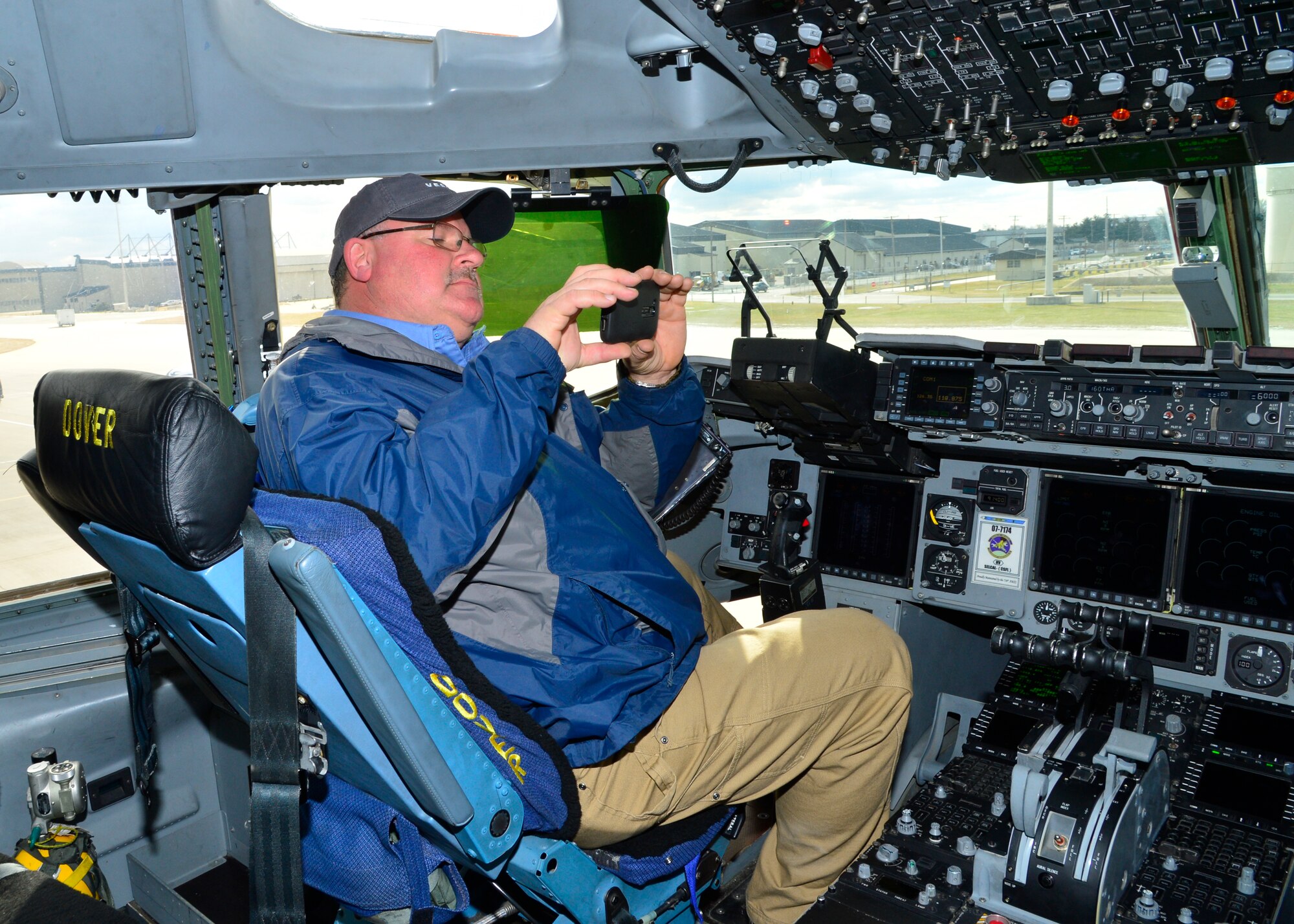 Jeff Habegger, Versar general superintendent, takes a photo from a C-17A Globemaster III during a tour Jan. 30, 2015, at Dover Air Force Base, Del. Habegger and other contractors will begin renovation operations Feb. 2 to runway 01-19 to rebuild the aging runway. (U.S. Air Force photo/Airman 1st Class William Johnson)