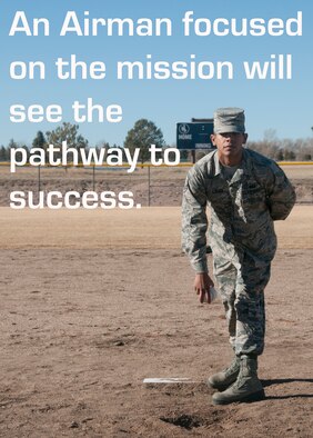 Airman 1st Class Ozzie Galvin, 90th Force Support Squadron, poses as a softball pitcher on a baseball field on F.E Warren Air Force Base, Wyo., Feb. 9, 2015. Galvin demonstrates the focused attention of a pitcher. (U.S. Air Force illustration/Lan Kim)
