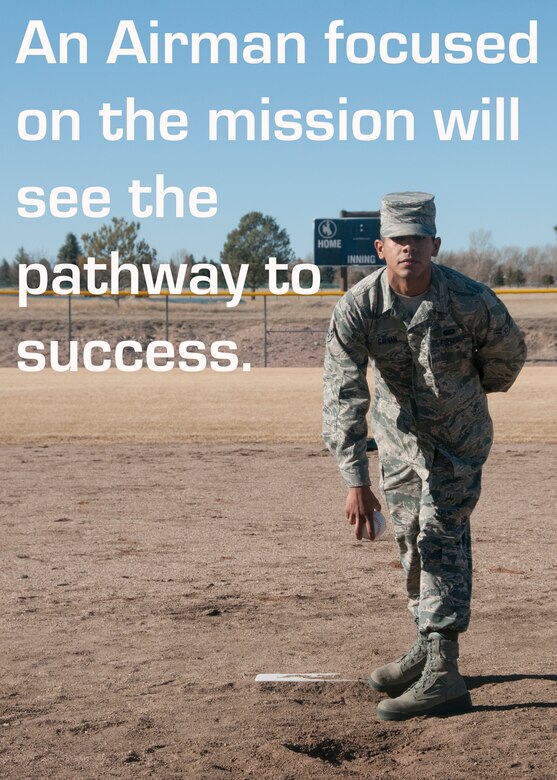 Airman 1st Class Ozzie Galvin, 90th Force Support Squadron, poses as a softball pitcher on a baseball field on F.E Warren Air Force Base, Wyo., Feb. 9, 2015. Galvin demonstrates the focused attention of a pitcher. (U.S. Air Force illustration/Lan Kim)
