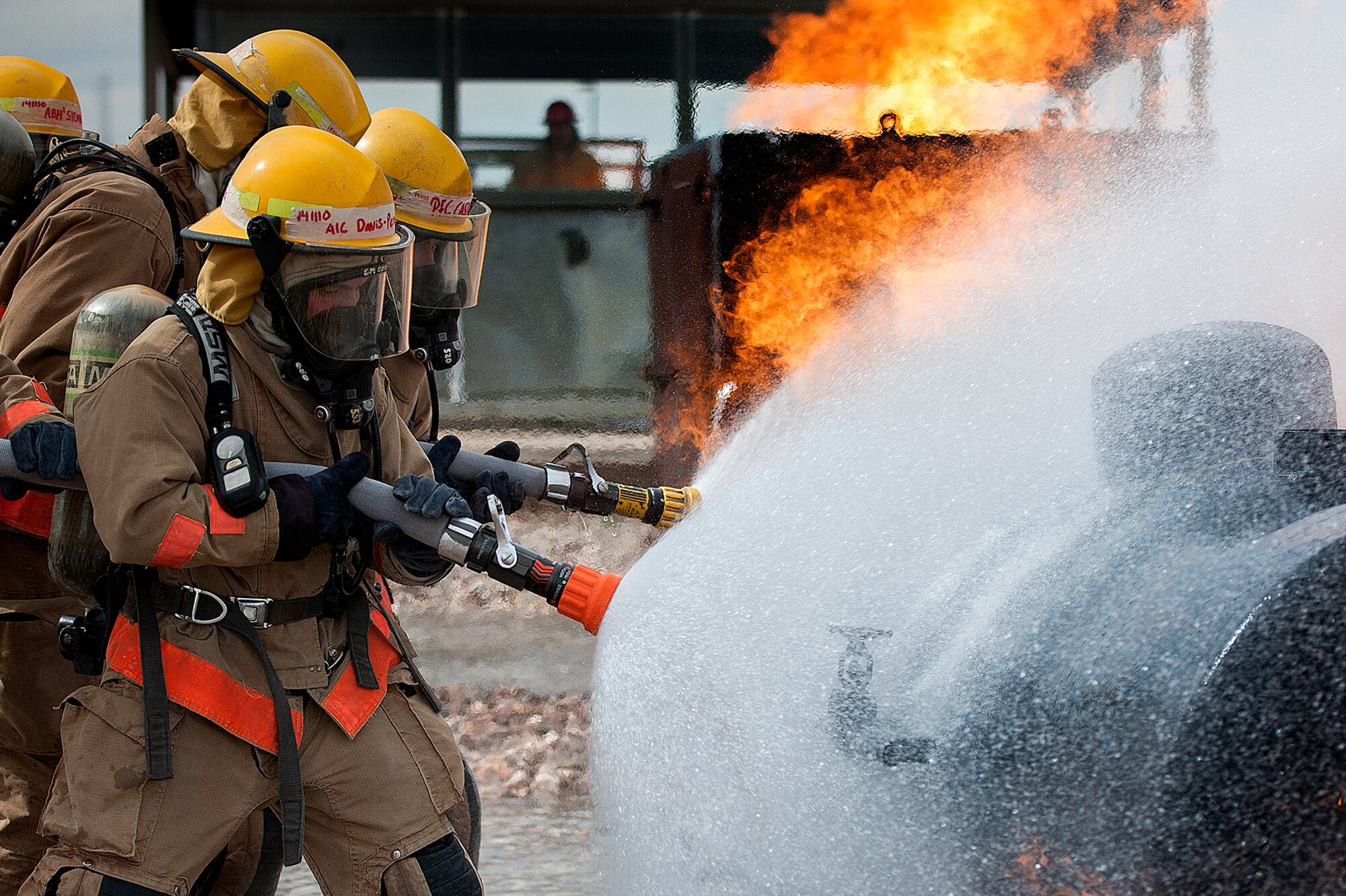 GOODFELLOW AIR FORCE BASE, Texas – 312th Training Squadron Students put out a fire during Block four training at the Louis F. Garland Department of Defense Fire Academy Feb. 3. Block four is the first training segment where students fight fires. (U.S. Air Force photo/ Airman 1st Class Devin Boyer)