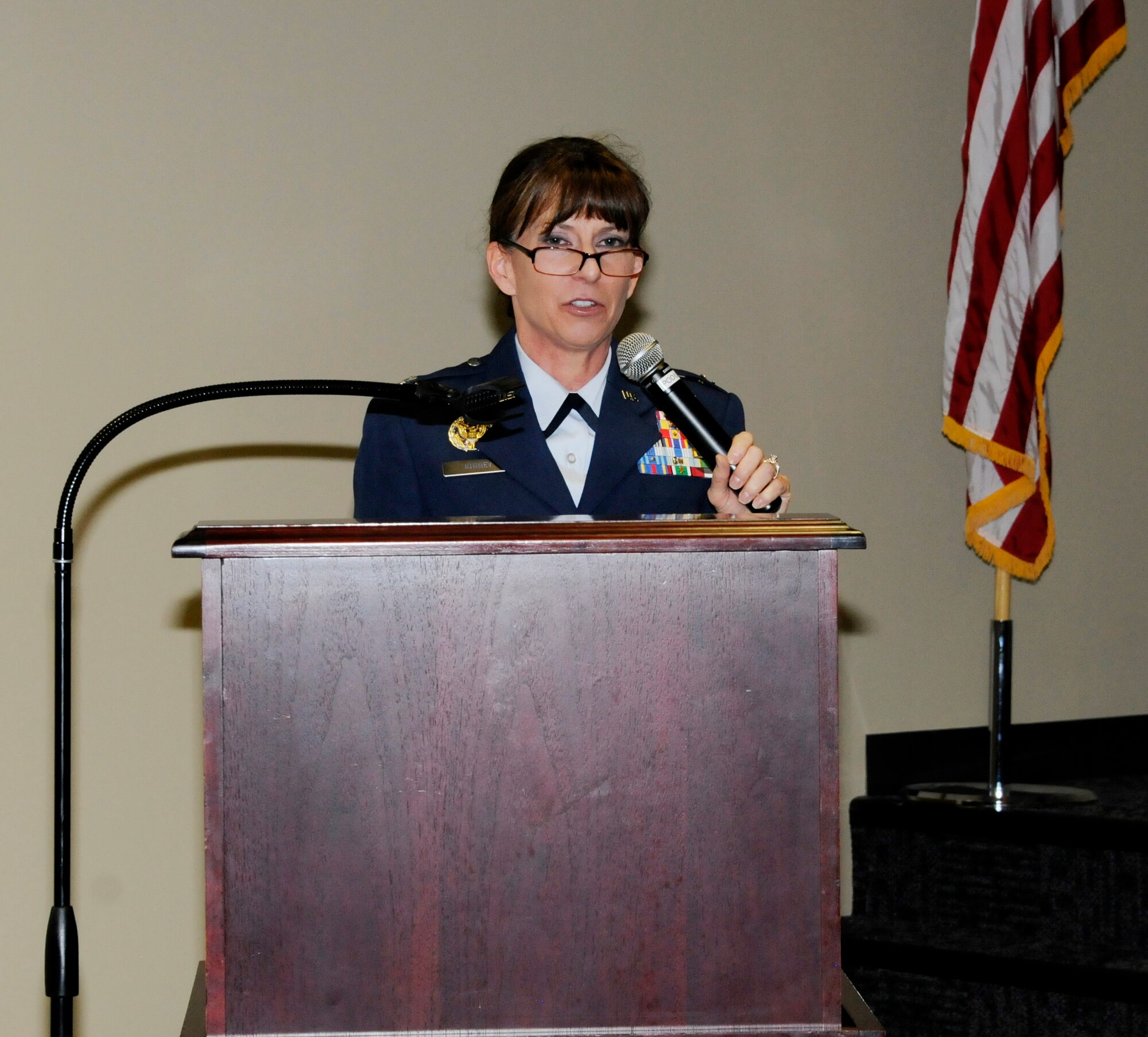Col. Paige I. Kinney speaks during a formal promotion ceremony for her husband, Col. Robert I. Kinney, 188th Intelligence, Surveillance and Reconnaissance Group commander, at Ebbing Air National Guard Base, Fort Smith, Ark., Feb. 8, 2015. Paige Kinney is the director of Intelligence, Surveillance and Reconnaissance at the Continental U.S. North American Aerospace Defense Command Region, 1st Air Force, Air Forces Northern, Tyndall Air Force Base, Fla. (U.S. Air National Guard photo by Staff Sgt. Hannah Dickerson/released)