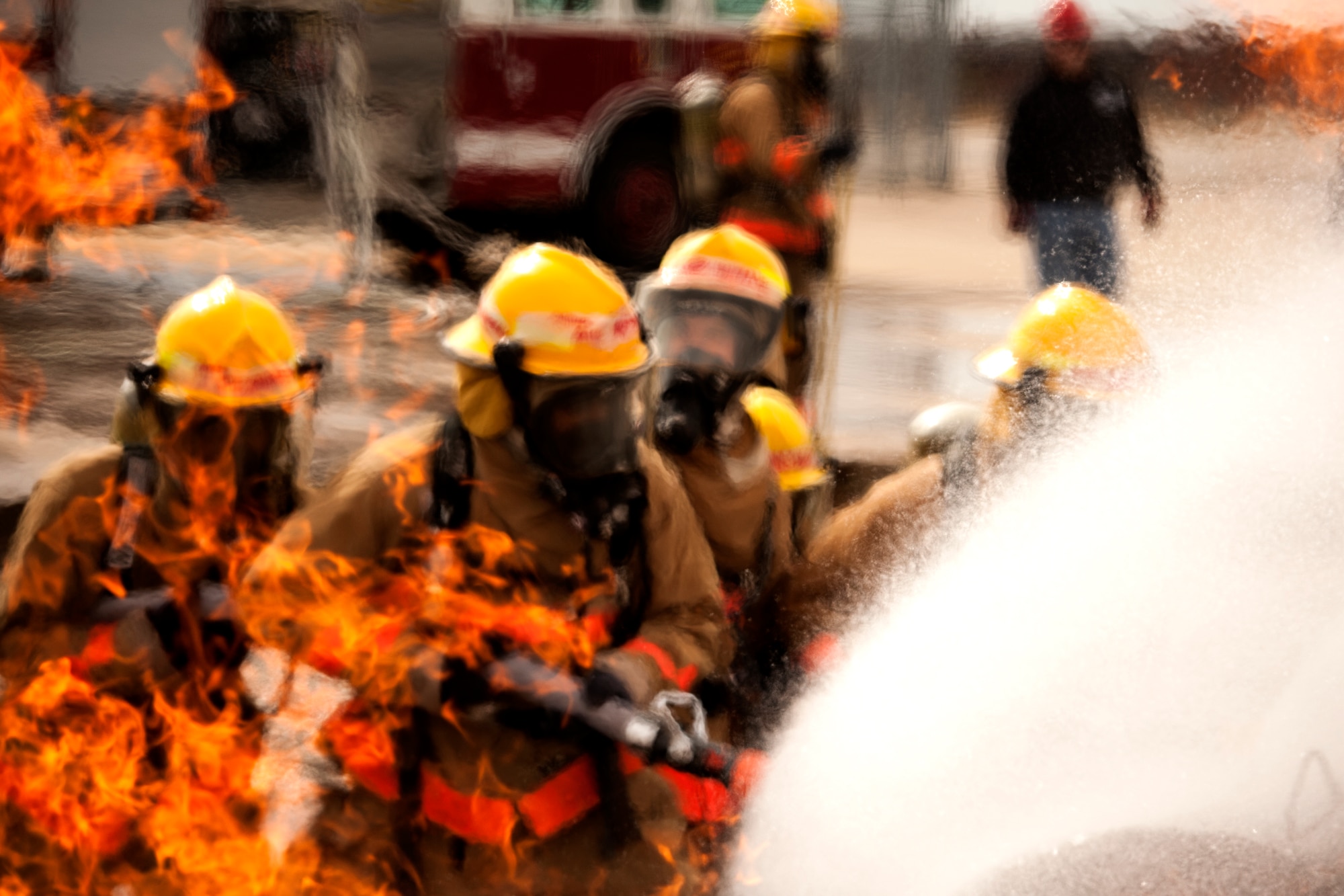 GOODFELLOW AIR FORCE BASE, Texas – Airman 1st Class Onnie O. McSpadden, 127th Michigan Air National Guard firefighting apprentice, leads his group to extinguish a fire, Feb. 3. The groups would rotate, each member being the lead on the water hose. 
(U.S. Air Force photo/ Senior Airman Scott Jackson)
