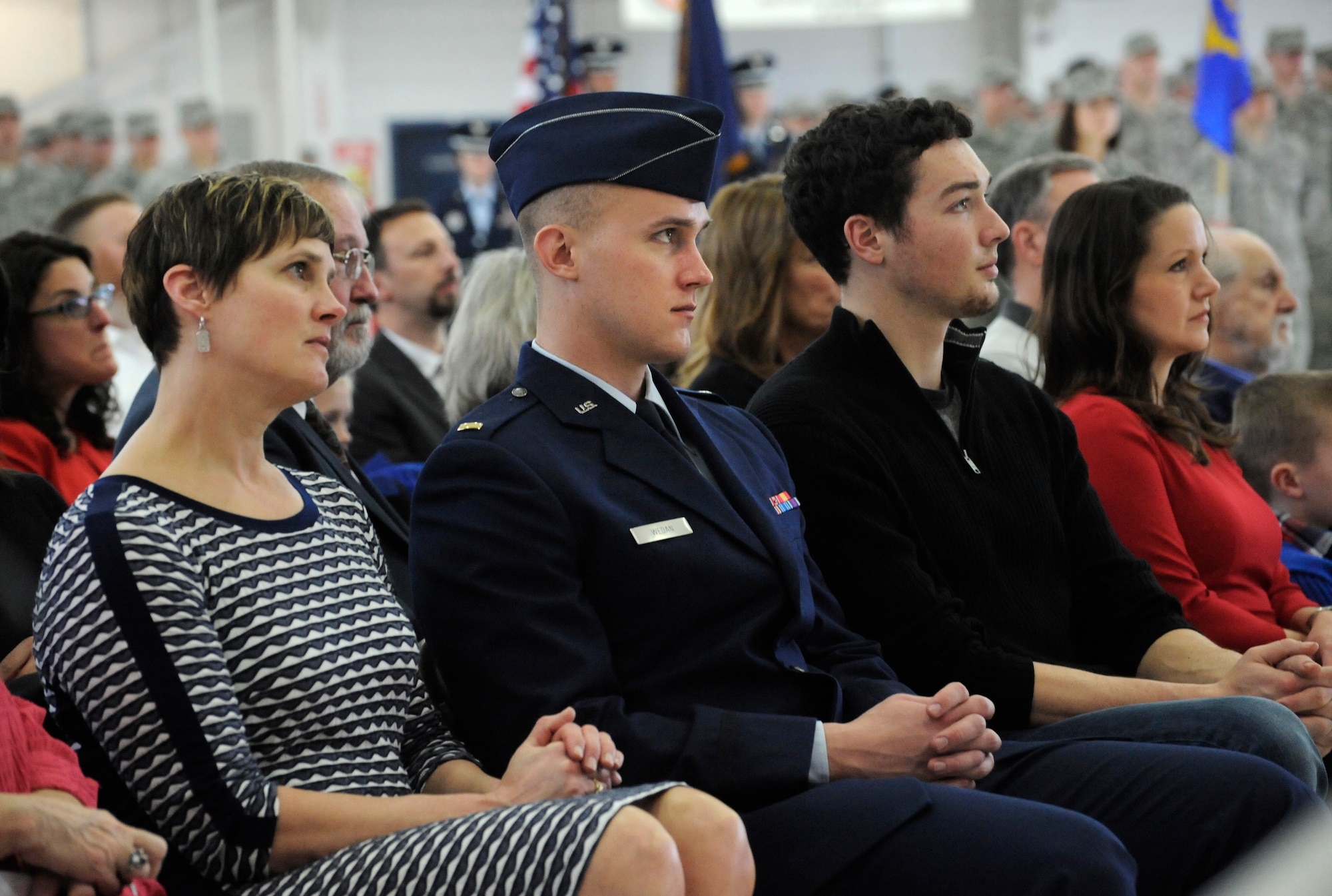 Family members of U.S. Air Force Col. Richard W. Wedan and U.S. Air Force Col. Paul T. Fitzgerald listen to remarks by members of the official party during the Change of Command ceremony held Feb. 7, 2015, Portland Air National Guard Base, Ore. (U.S. Air National Guard photo by Tech. Sgt. John Hughel, 142nd Fighter Wing Public Affairs)