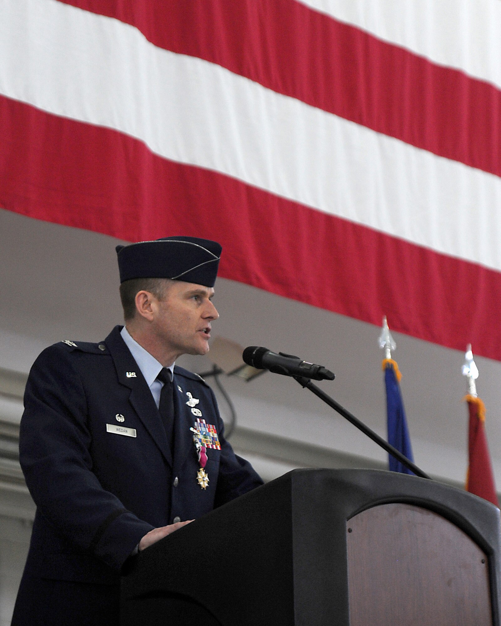 U.S. Air Force Col. Richard W. Wedan, outgoing commander 142nd Fighter Wing, Oregon Air National Guard, gives his farewell remarks as commander of the 142nd Fighter Wing to those attending the Change of Command ceremony for the wing, held at the Portland Air National Guard Base, Ore. Feb. 7, 2015. (U.S. Air National Guard photo by Staff Sgt. Brandon Boyd, 142nd Fighter Wing Public Affairs)