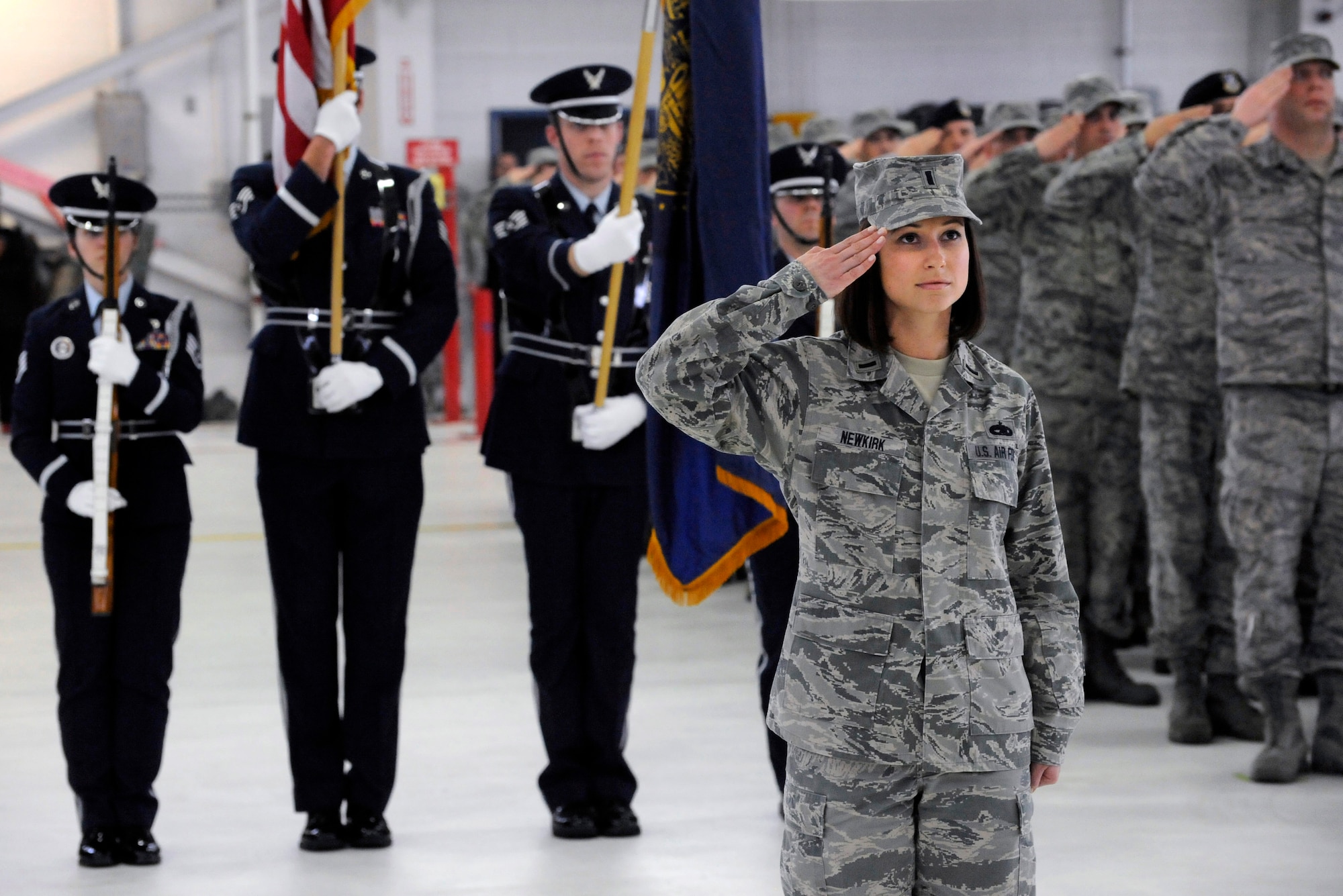 The Adjutant of ceremony, 1st Lt. Amy Newkirk, assigned to the 142nd Fighter Wing maintenance group, salutes the command during the Change of Command ceremony held Feb. 7, 2015, Portland Air National Guard Base, Ore. Col. Paul T. Fitzgerald assumed command of the wing as Col. Richard W. Wedan who retired after more than 27 years of service in the U.S. Air Force. (U.S. Air National Guard photo by Tech. Sgt. John Hughel, 142nd Fighter Wing Public Affairs) 