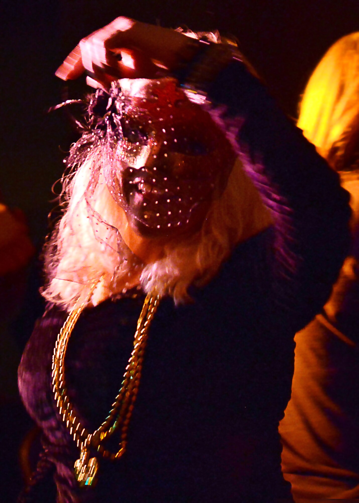 A Joint-Base Langley-Eustis community member dances during the Mardi Gras celebration at Fort Eustis, Va., Feb 6, 2015. Mardi Gras is traditionally a celebratory masquerade before Ash Wednesday, however the modern westernized Mardi Gras may often be a morale event with music, games and comfort food. (U.S. Air Force photo by Airman 1st Class Devin Scott Michaels/Released)