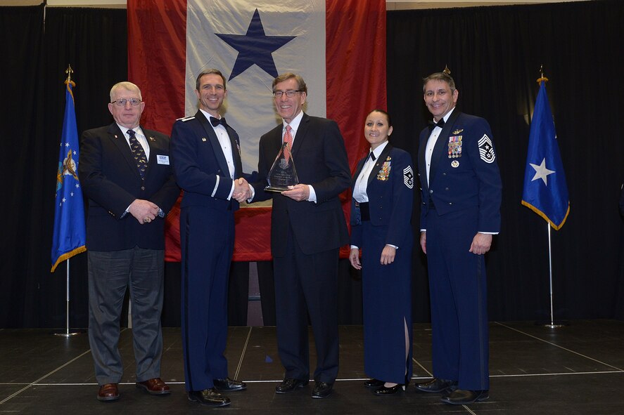 Scott Anderson (center), president and CEO of Zions Bank, accepts the 419th Fighter Wing Employer of the Year award from Col. Bryan Radliff, 419th FW commander, and representatives from Air Force Reserve Command and the local Employer Support of the Guard and Reserve during a ceremony Feb. 7. 